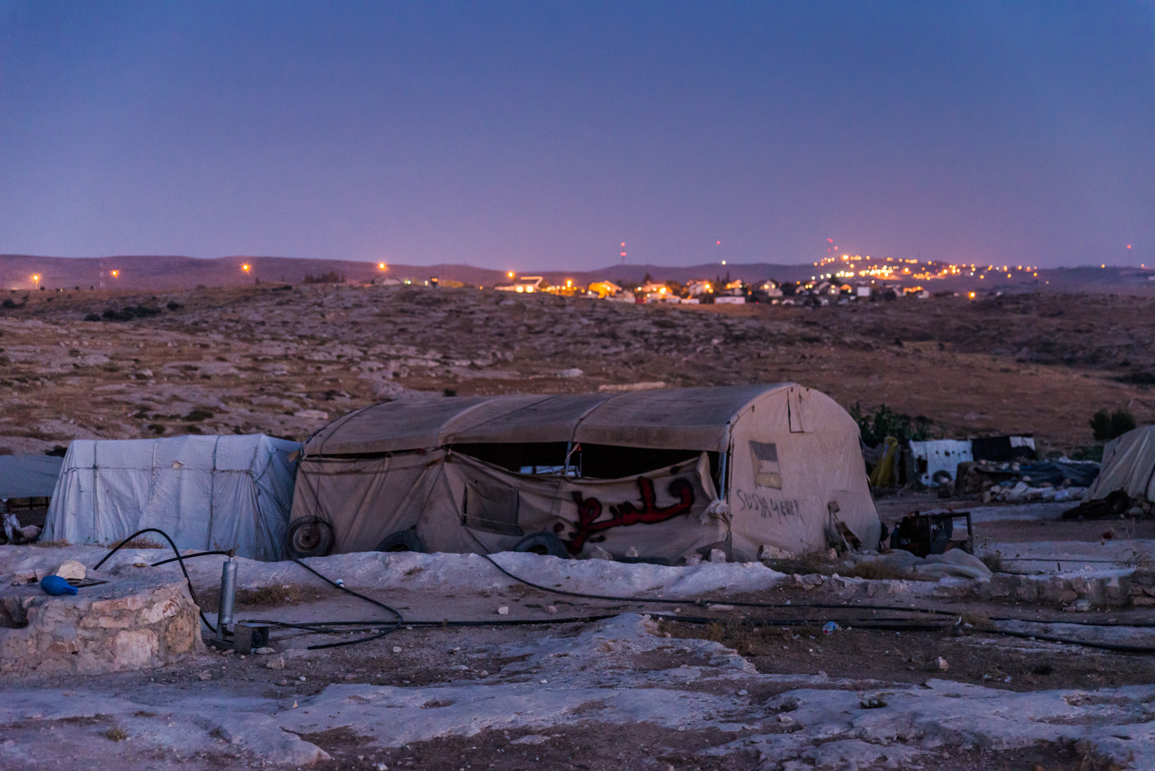 The residents of Susiya live in tents and caves without access to running water or electricity. The nearby illegal Israeli settlement has both in abundance.