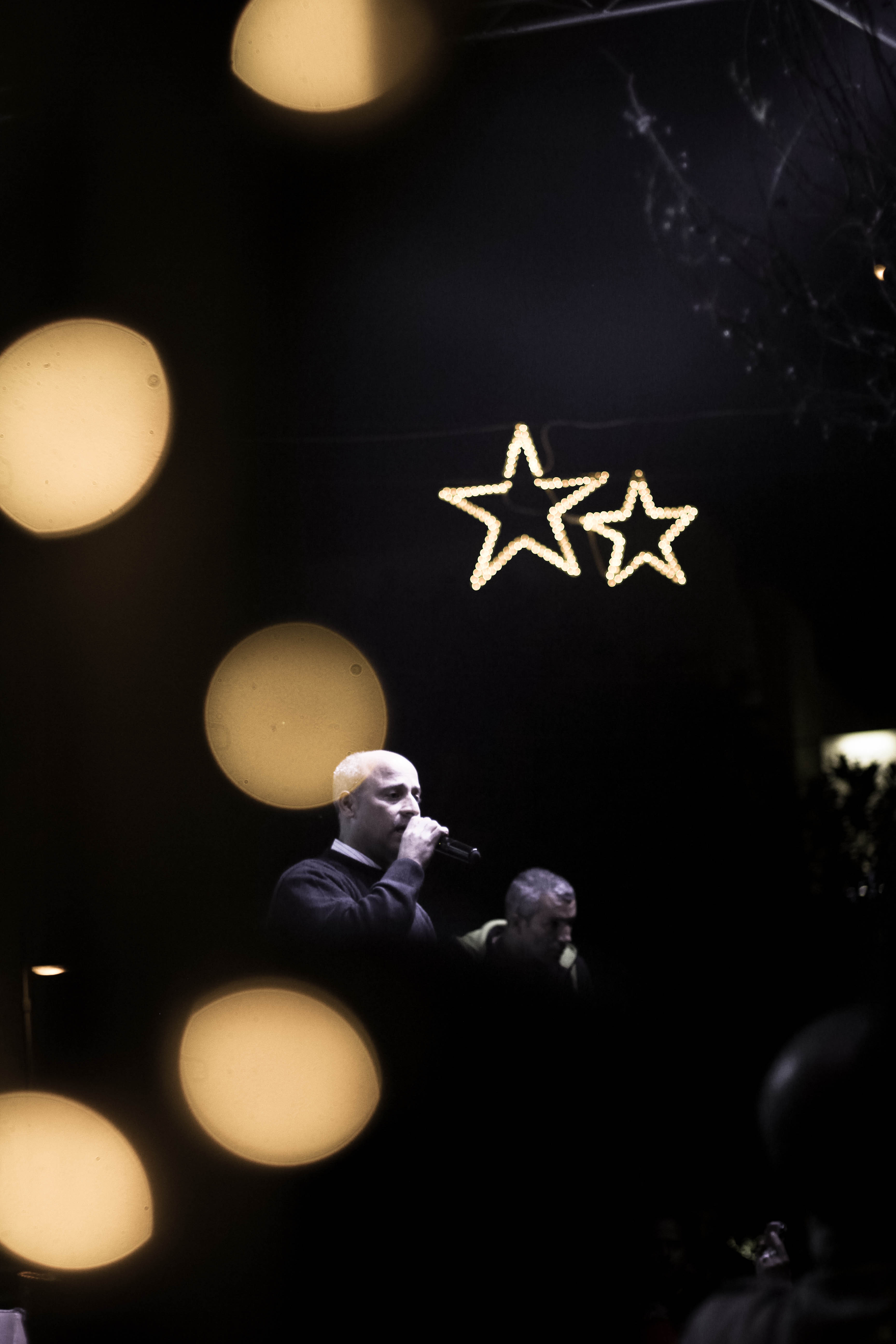 David Hodali singing during the Christmas tree lighting