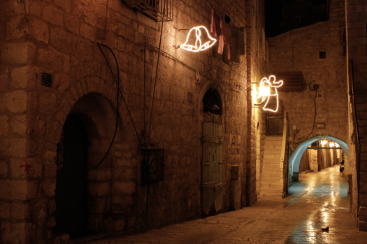 Christmas decorations on the sides of buildings in Bethlehem. (PHOTO: Firas Mukarker)