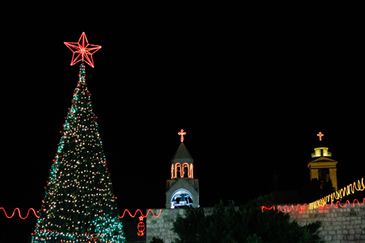 The Christmas tree and church punctuate the skyline of Bethlehem's Manger Square. (PHOTO: Firas Mukarker)